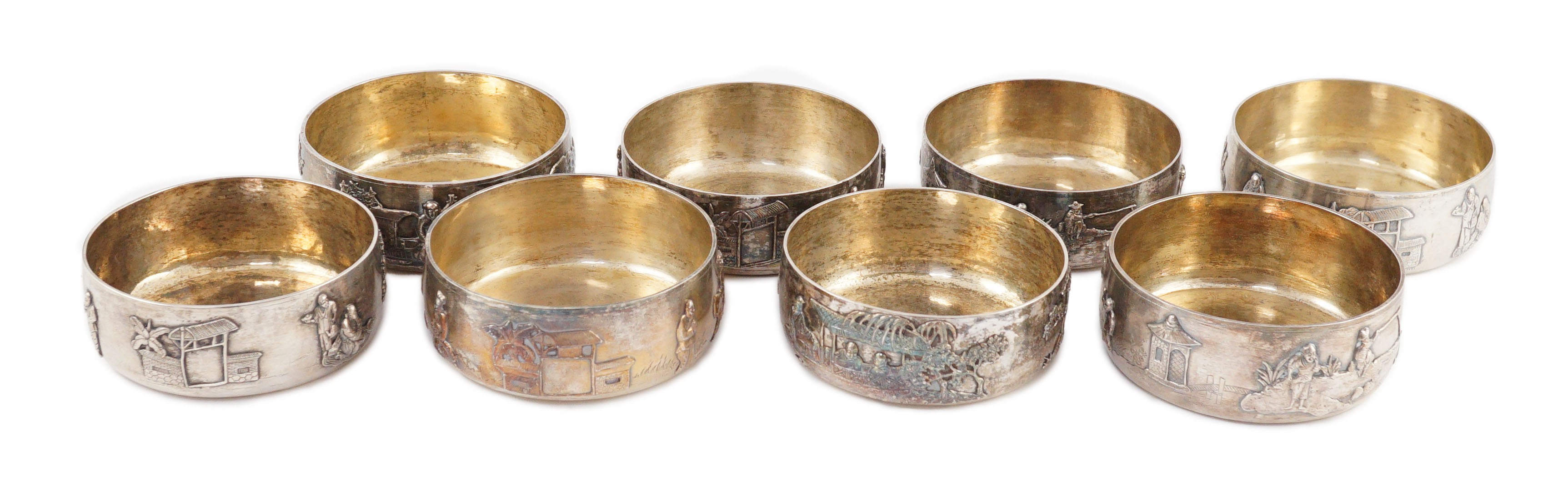 A set of four Chinese Export silver finger bowls, by Wang Hing, Hong Kong and one other set of four Chinese Export silver finger bowls